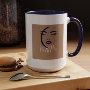 PerfectnElite neutral coffee mug with minimalist face logo sitting beside a pour-over coffee maker on a modern kitchen counter.